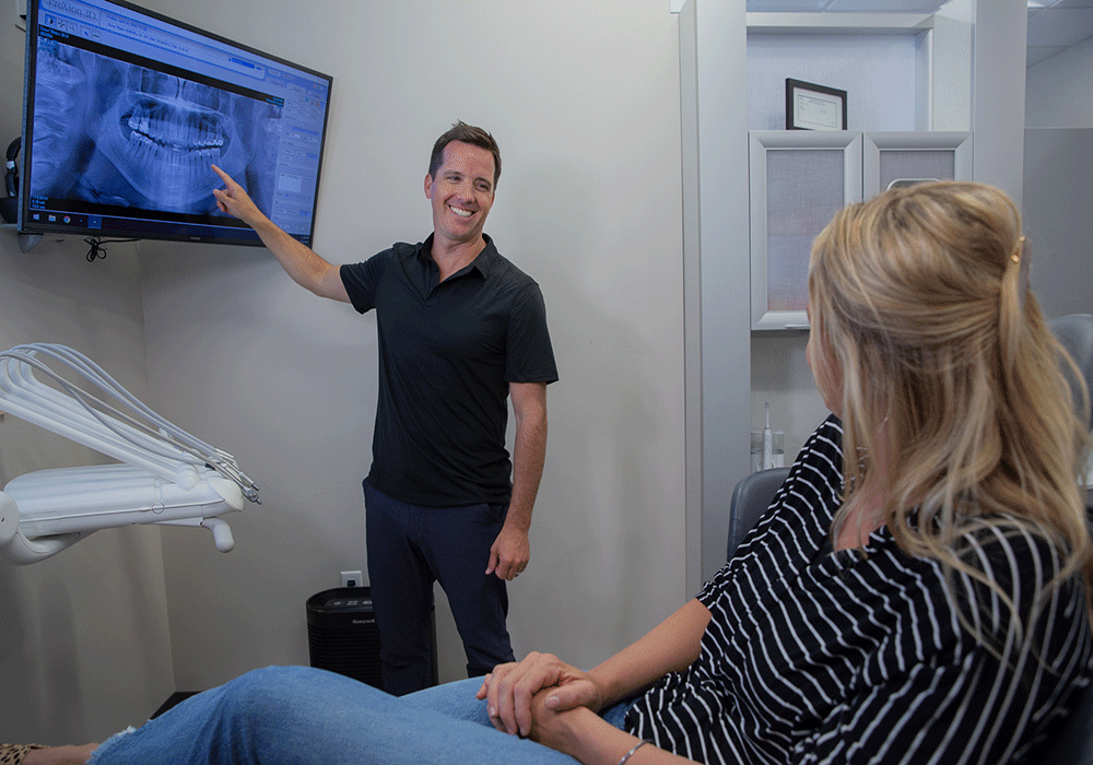Dr. Drew showing X-rays to a patient at Drew Family Dentistry in Bend, OR.